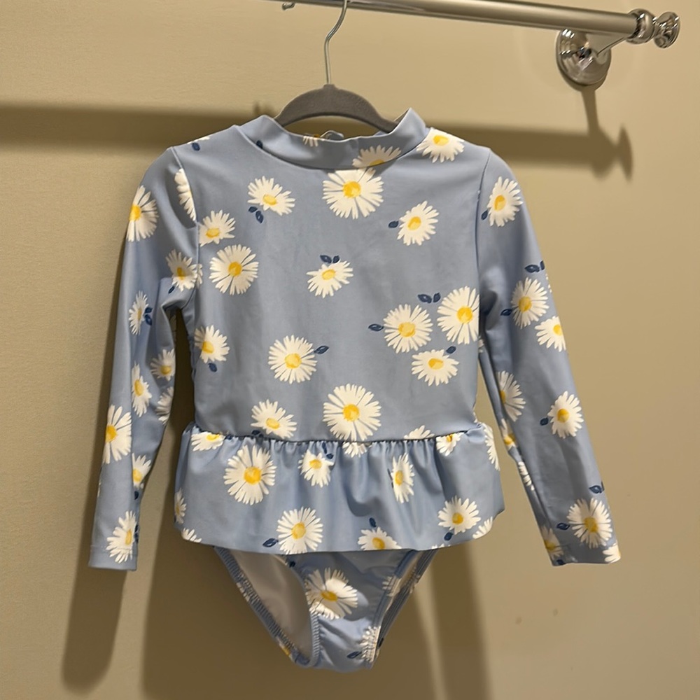 Carter’s blue swimsuit with daises. Size 18mo